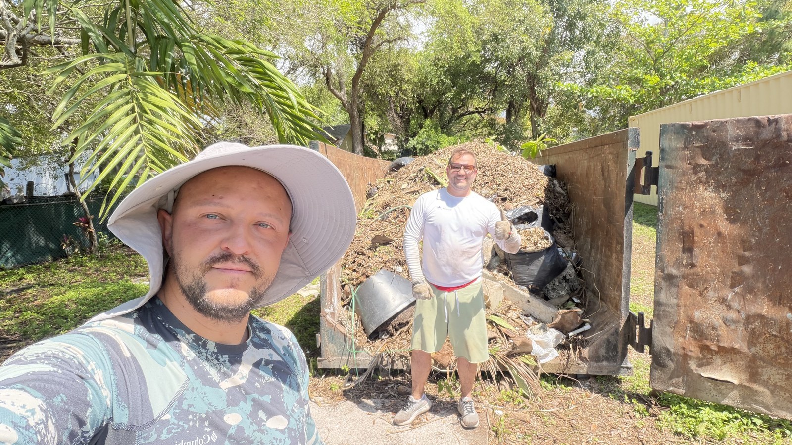 Marat and Mark on-site in Little Haiti, clearing the lot before construction.